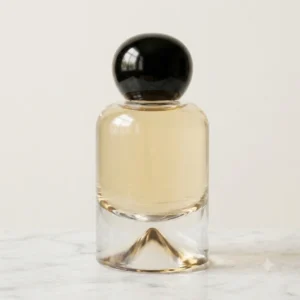 rounded glass perfume bottle with colorful cap for luxury fragrance