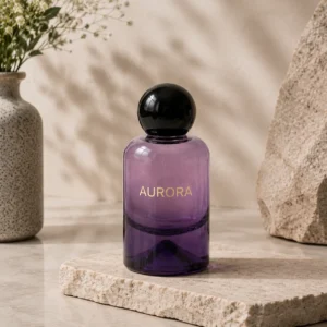 purple rounded glass perfume bottle with black ball cap