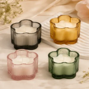 Colorful flower-shaped ribbed glass candle jars for home fragrance collections