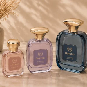 square glass perfume bottles with gold-tone caps in three colors